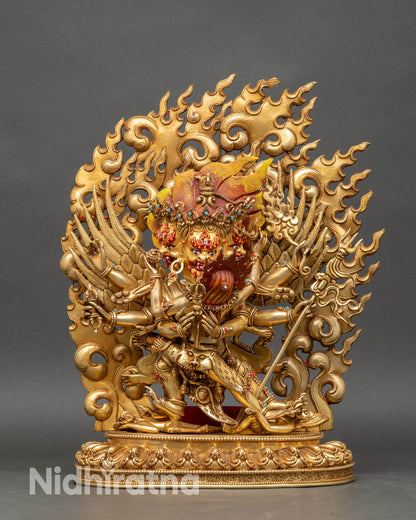 Front view of Vajrakilaya statue handcrafted in copper with gold fire-gilding and semi-precious stones.