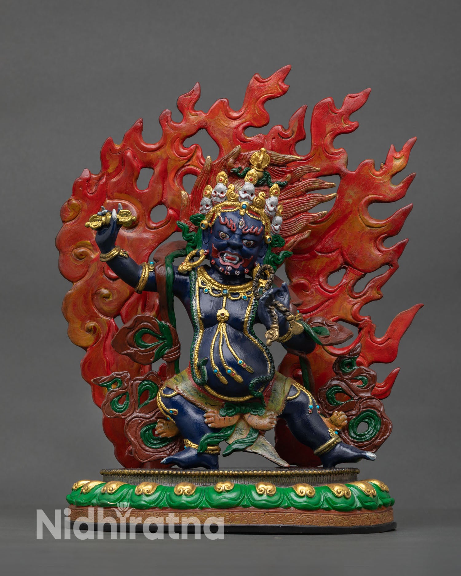 Front view of Vajrapani statue, copper sculpture hand painted acrylic colors semi precious stones flaming halo Nepal artisan craftsmanship