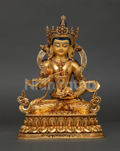 front view of vajrasattva copper statue seated on double lotus throne with gold gilding and vajra and bell