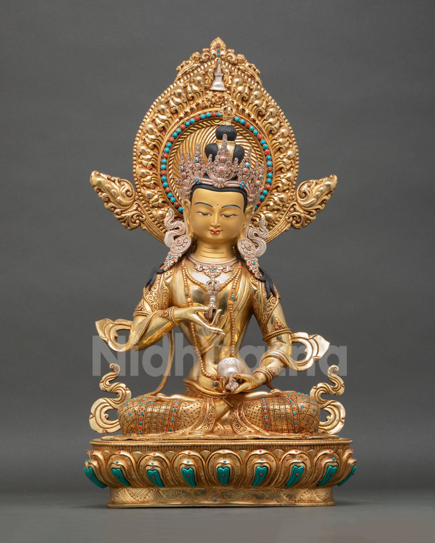 Front view of Vajrasattva statue handcrafted copper Buddhist deity sculpture from Nepal with gold gilded and silver plated detailing and lotus pedestal