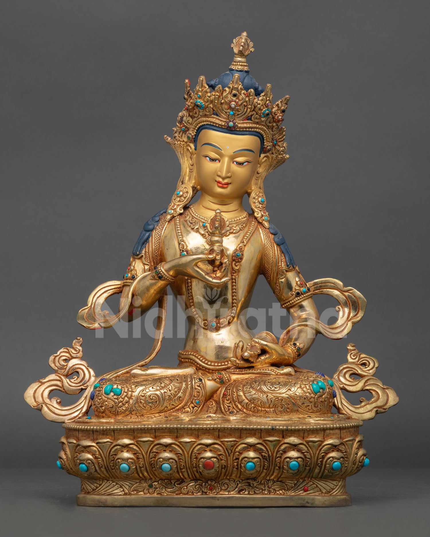 Front view of Vajrasattva statue, handmade in Nepal by Newari artisan in copper with gold gilding, five jeweled crown, seated on lotus pedestal