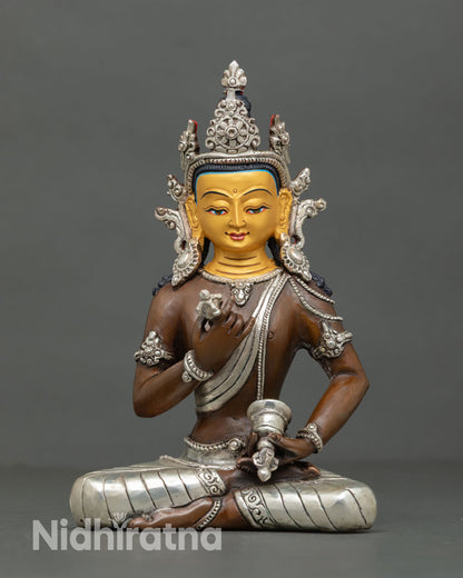 Front view of Vajrasattva statue oxidized copper silver plated details 24K gold face handmade Nepal Buddhist altar sculpture