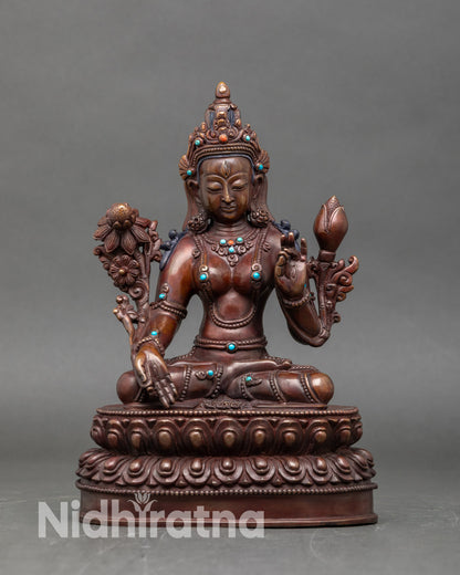 Front view of White Tara oxidized copper statue handmade Nepalese Buddhist deity art