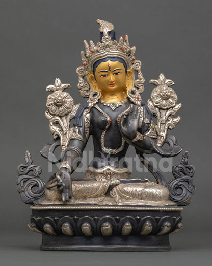 Front view of White Tara statue, oxidized and silver plated finish featuring gold painted face and seated meditation posture for altar decor and spiritual space.