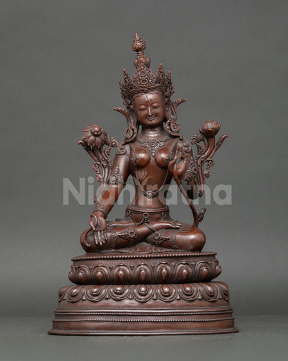Front view White Tara statue, oxidized copper, seated goddess of longevity on lotus, Nepal art