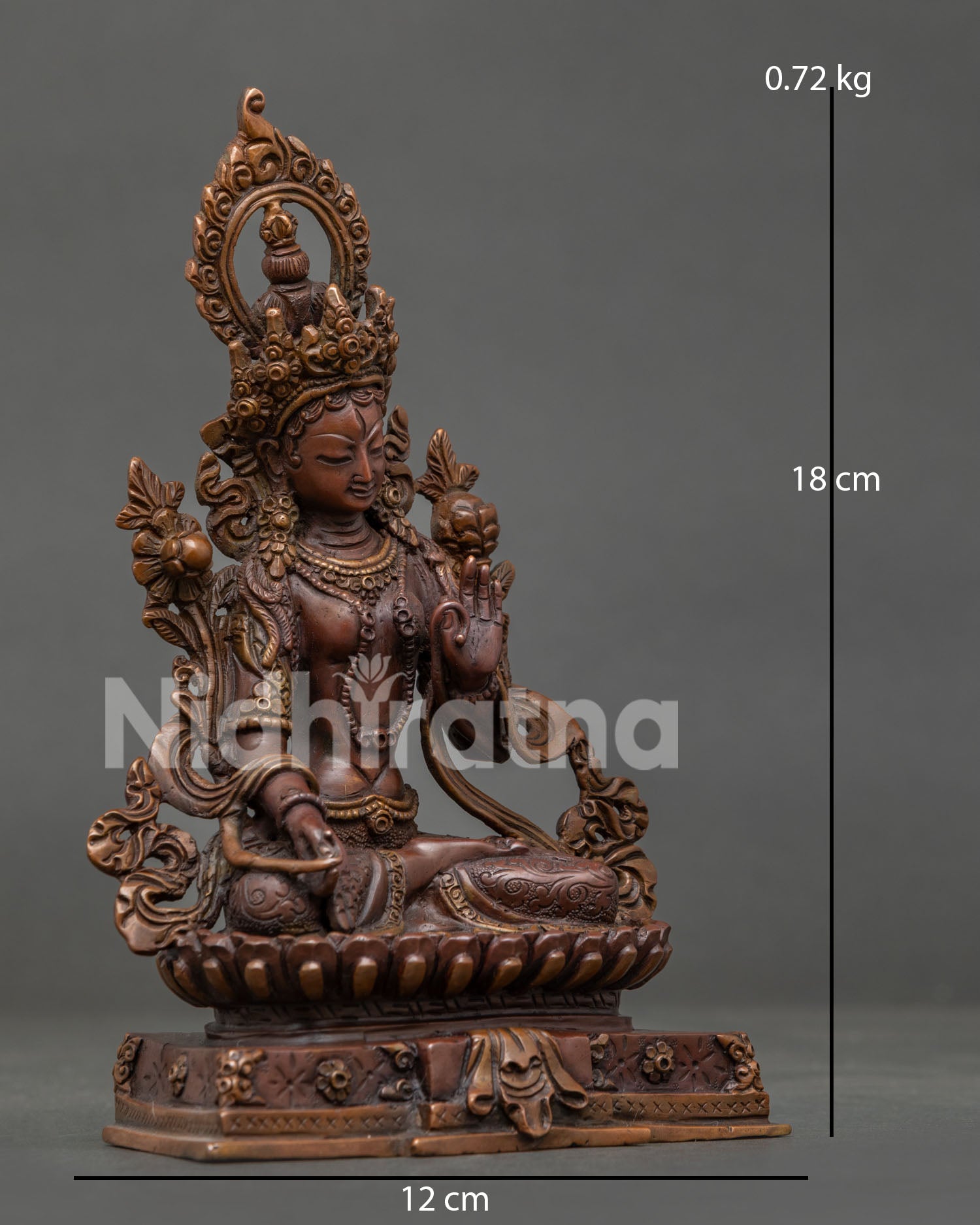 Front view White Tara statue with seven all-seeing eyes and lotus pedestal.