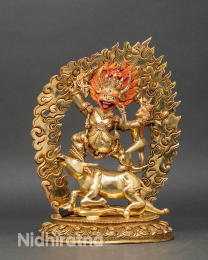 Front view Yamantaka statue handcrafted in copper, fire-gilded in gold, standing on a buffalo
