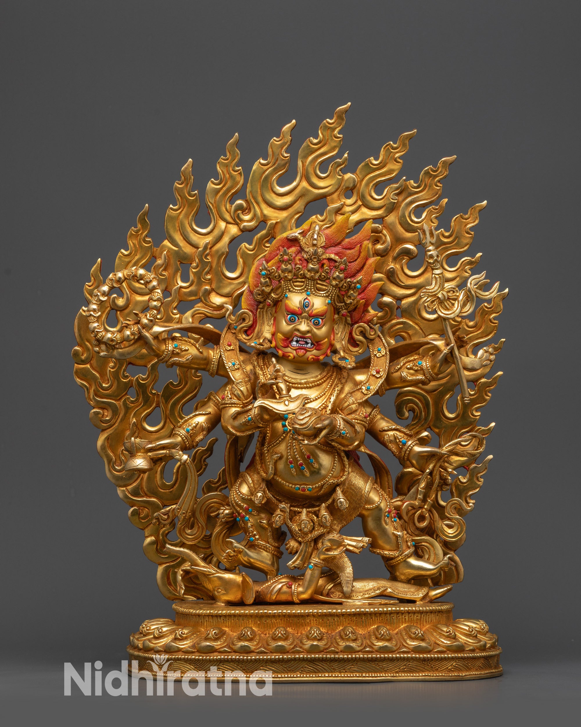 front view Dharma Protector Mahakala Statue with gold-gilded face and six arms
