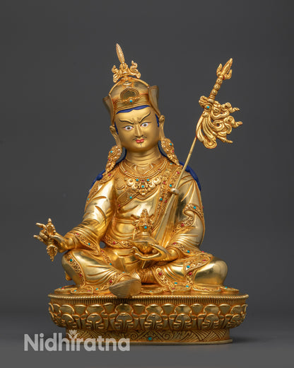 front view Guru Padmasambhava statue with gold-gilded face and lotus hat
