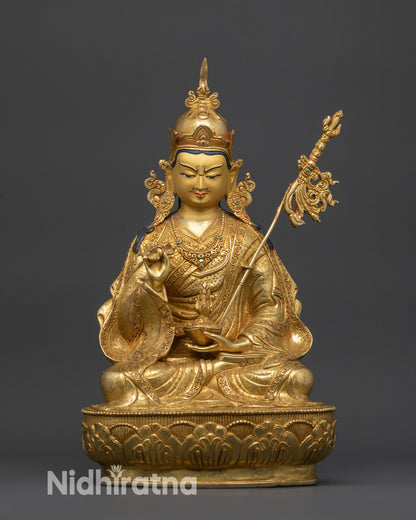 front view Guru Tsokye Dorje statue with gold-gilded face and lotus pedestal detail
