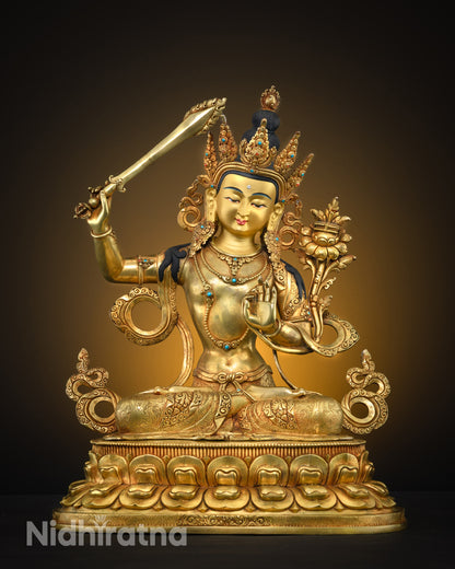 front view Manjushri statue seated on lotus with sword and hand mudra adorned with semi-precious stones