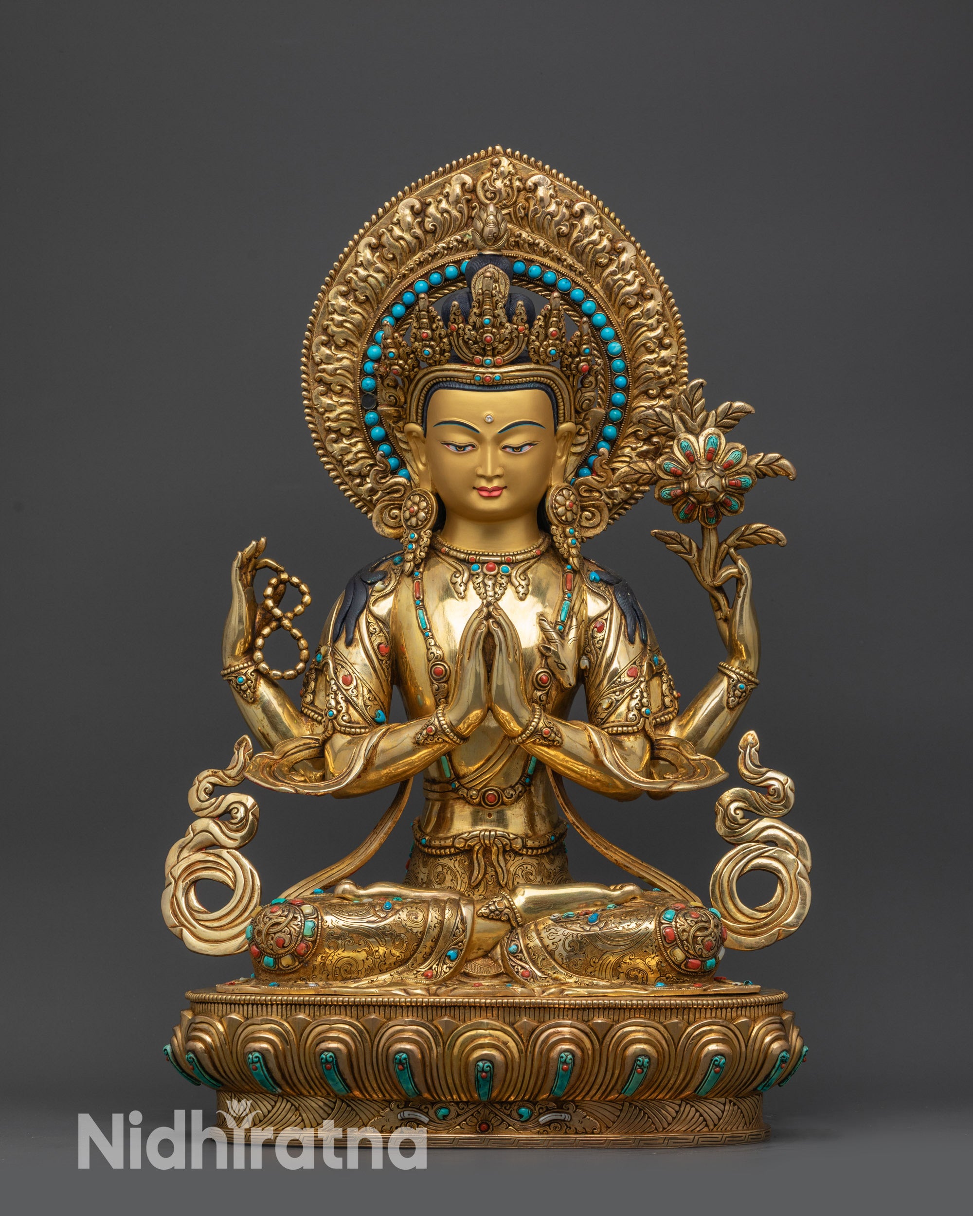 front view Sacred Four-Armed Chenrezig statue seated on lotus base with majestic halo