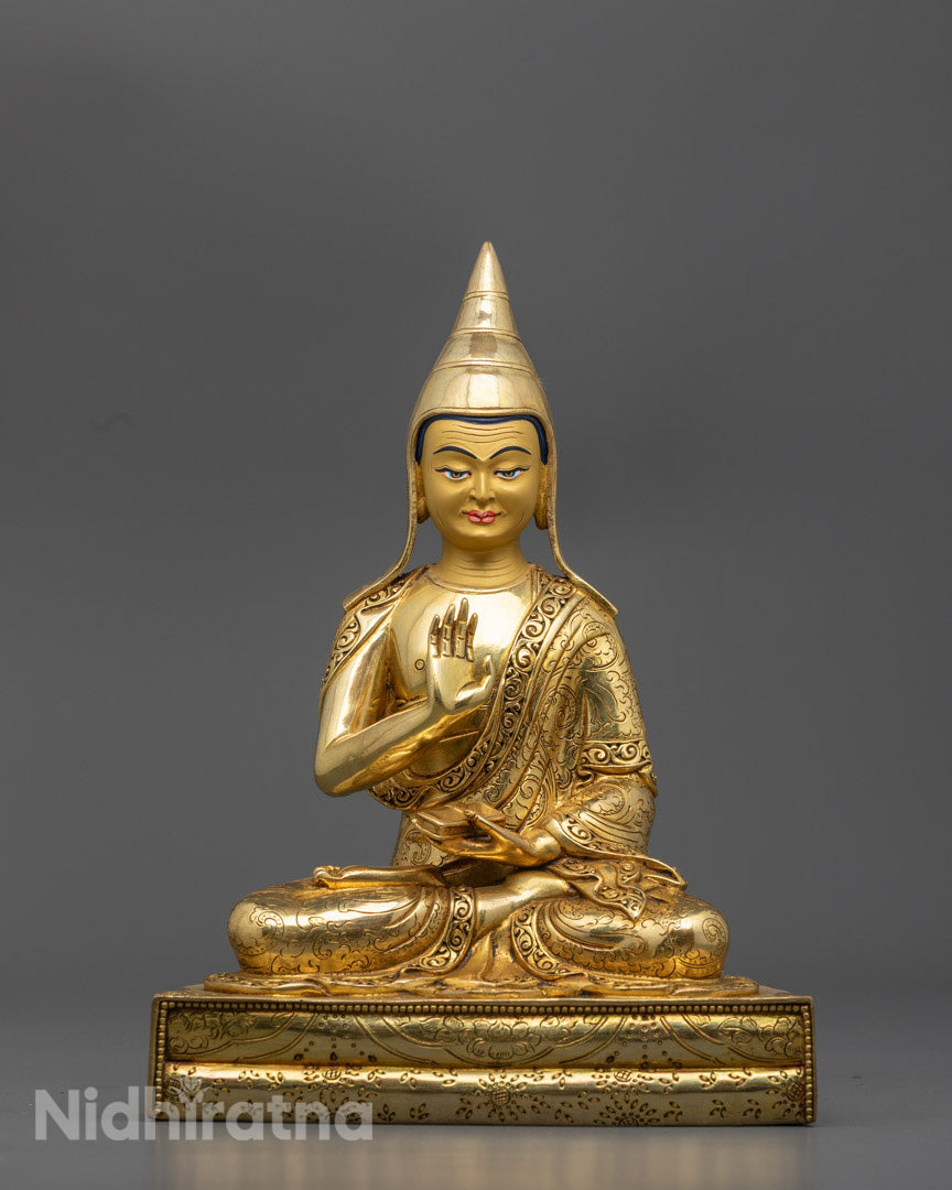 front view Santaraksita statue with gold-gilded face and yellow lama hat