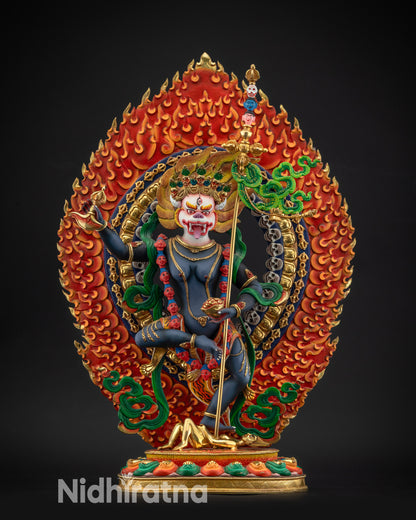 front view Simha Mukha statue with five-skull crown and fierce protective stance
