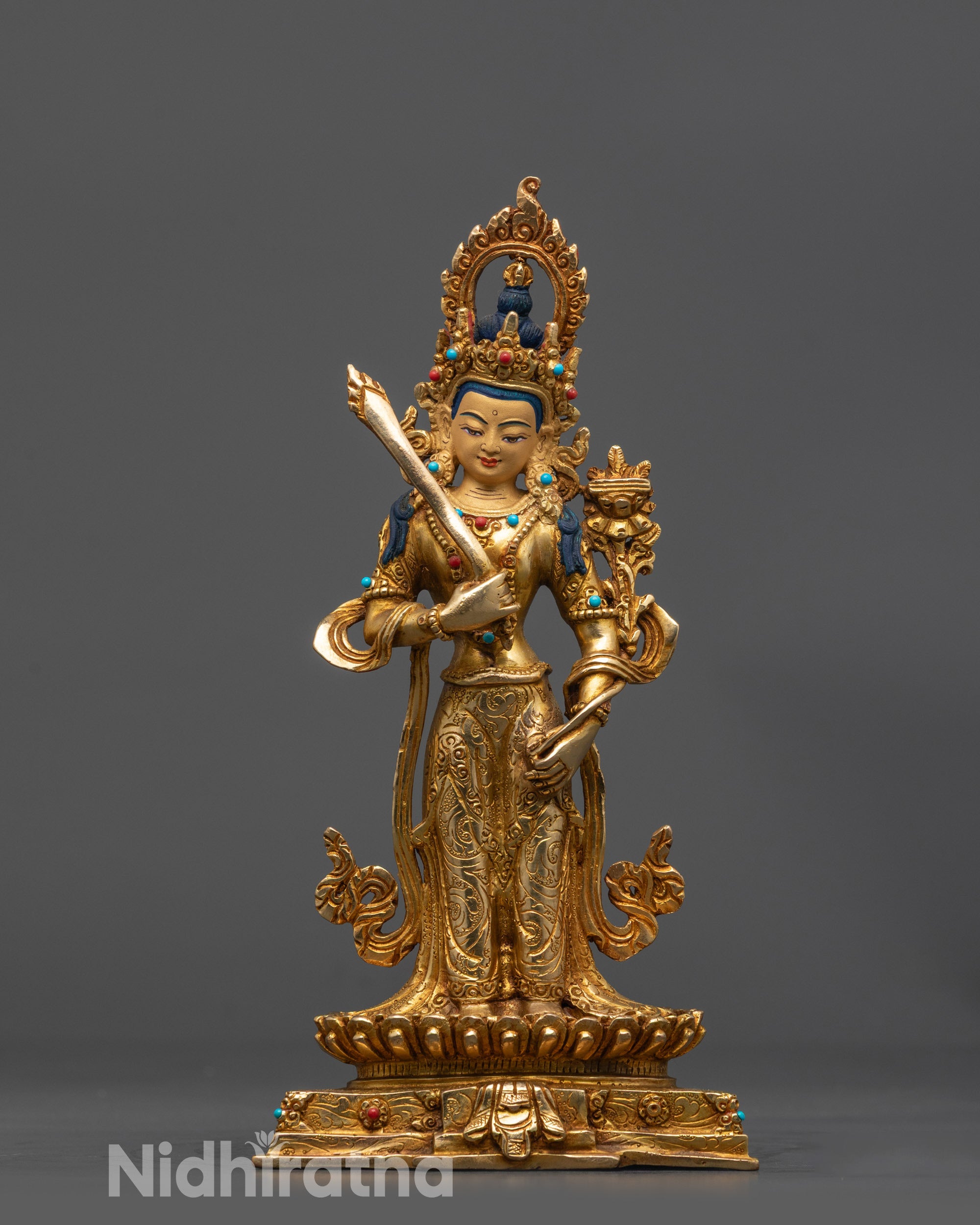 front view Standing Manjushri Statue with gold gilded face and lotus seat
