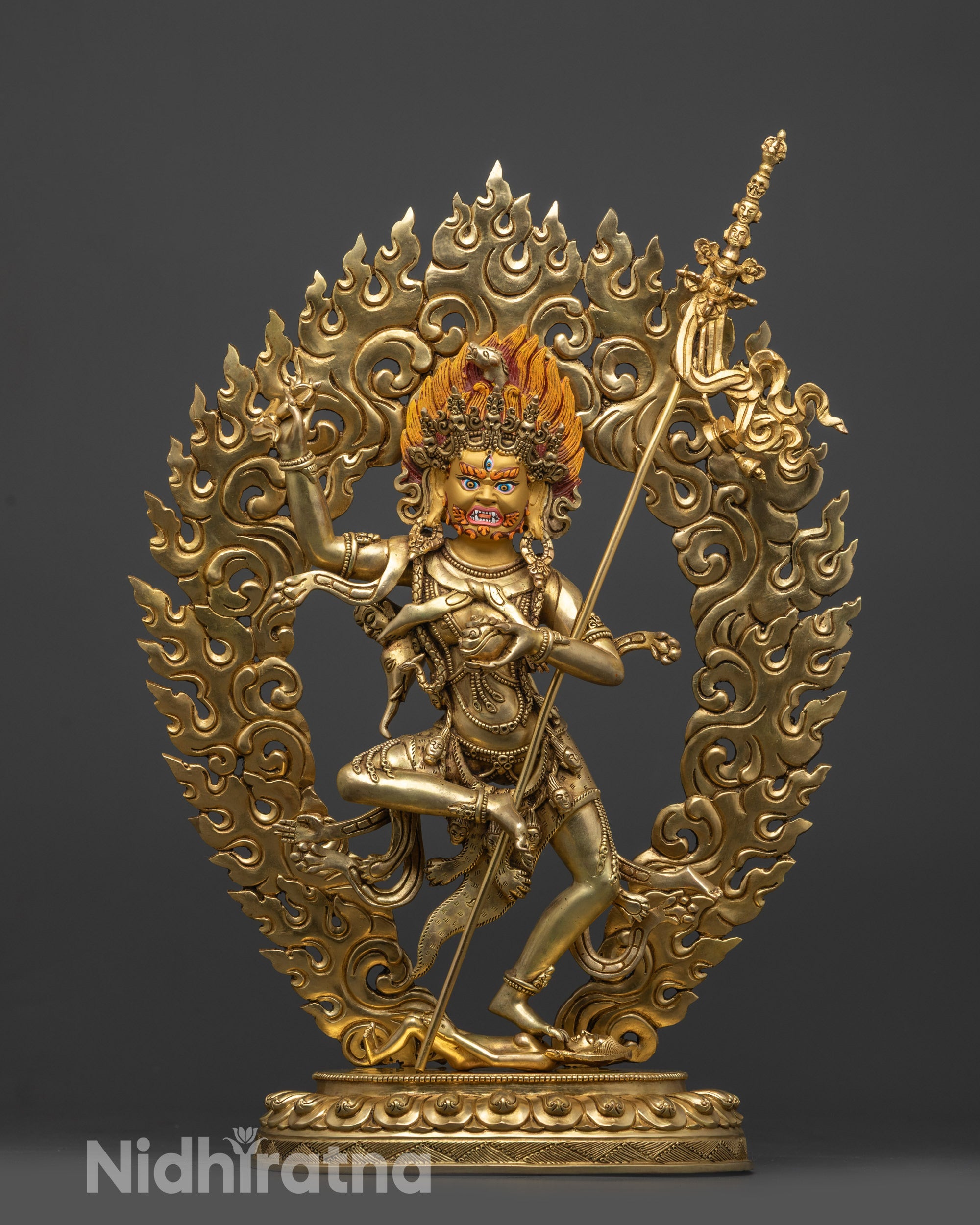 front view Troma Nagmo statue with gold fire gilded body and wrathful details
