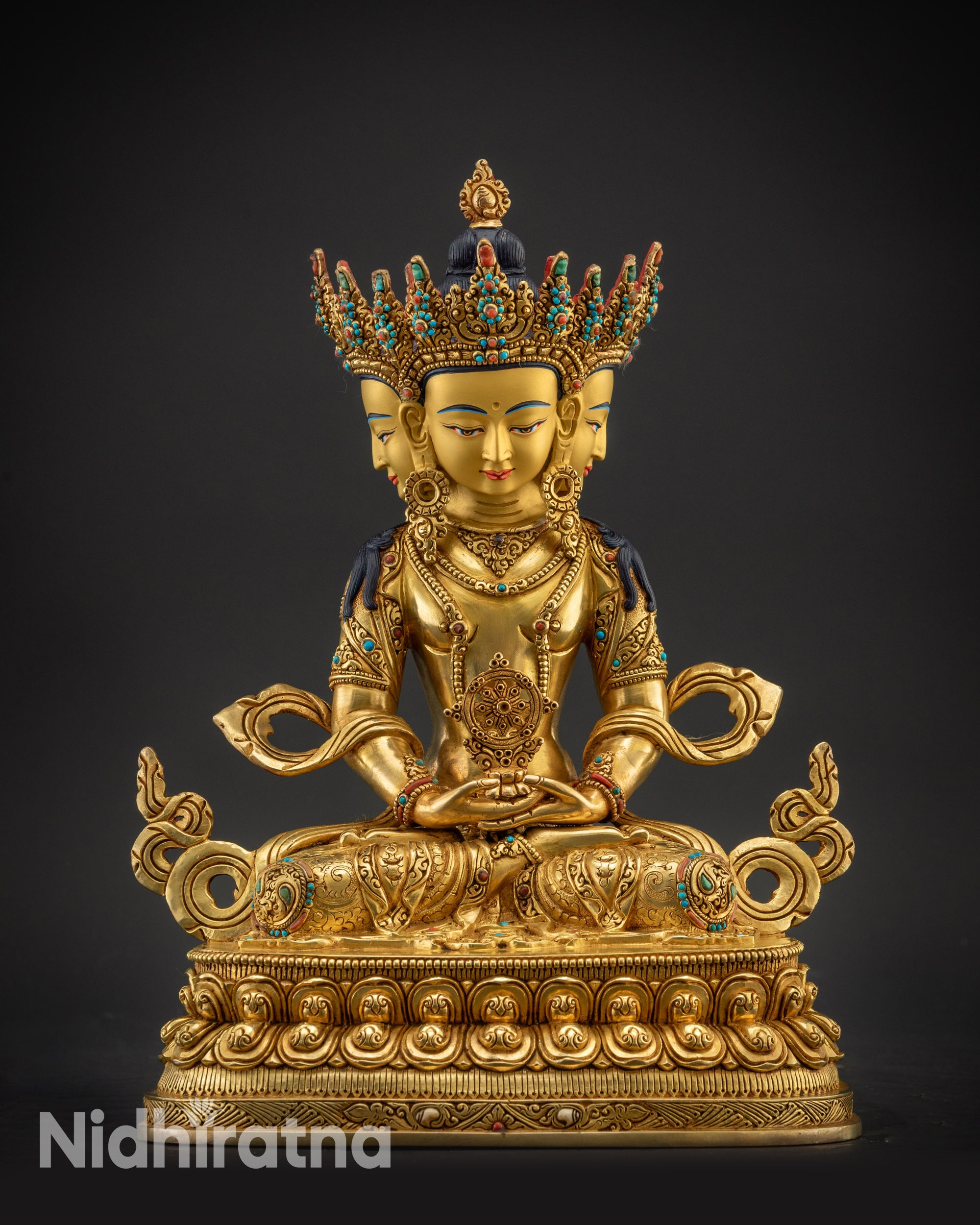 front view Vairocana Buddha statue with four gold-gilded faces on lotus pedestal from Nepal
