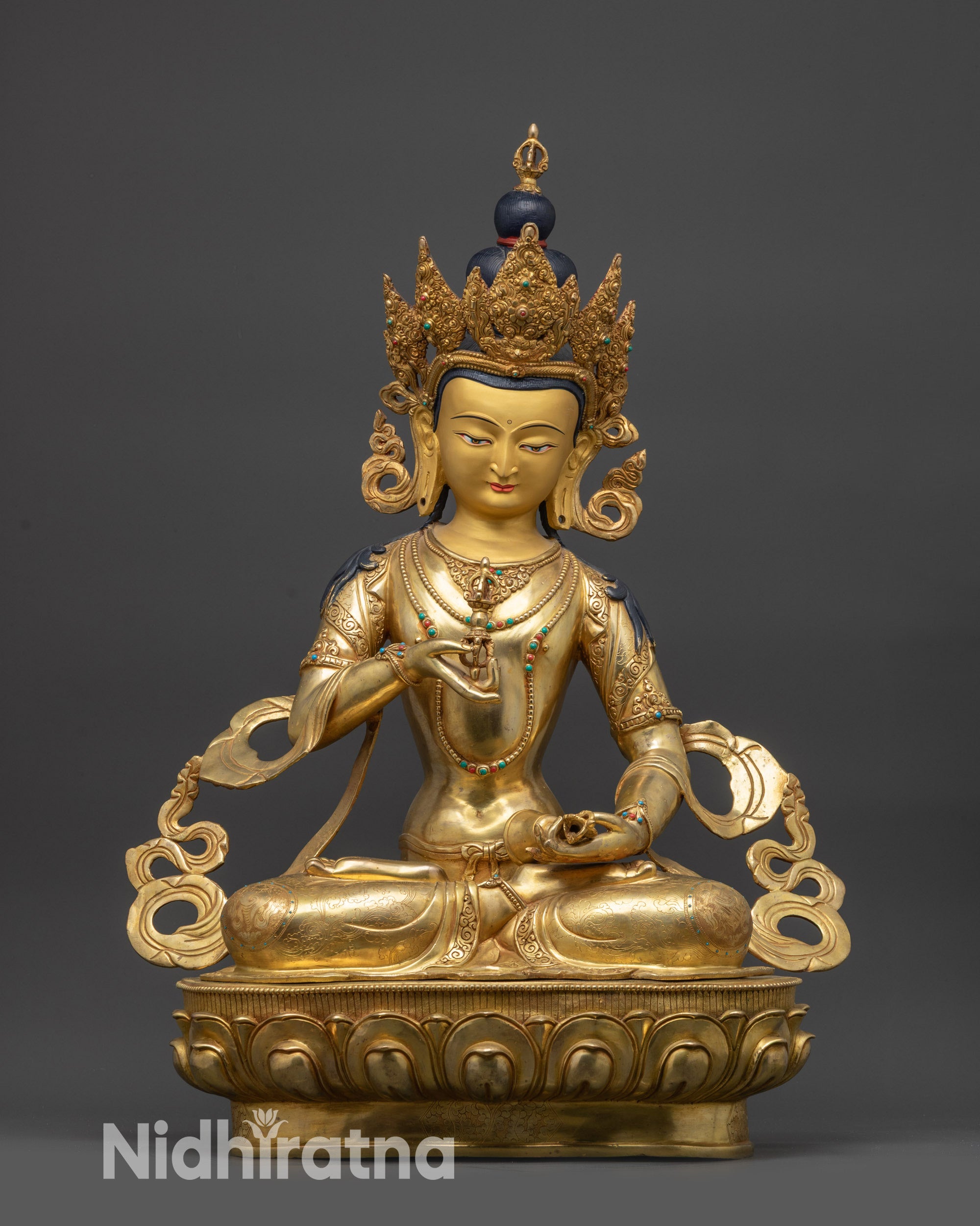 front view Vajrasattva statue on lotus seat with gold-gilded face and jeweled crown
