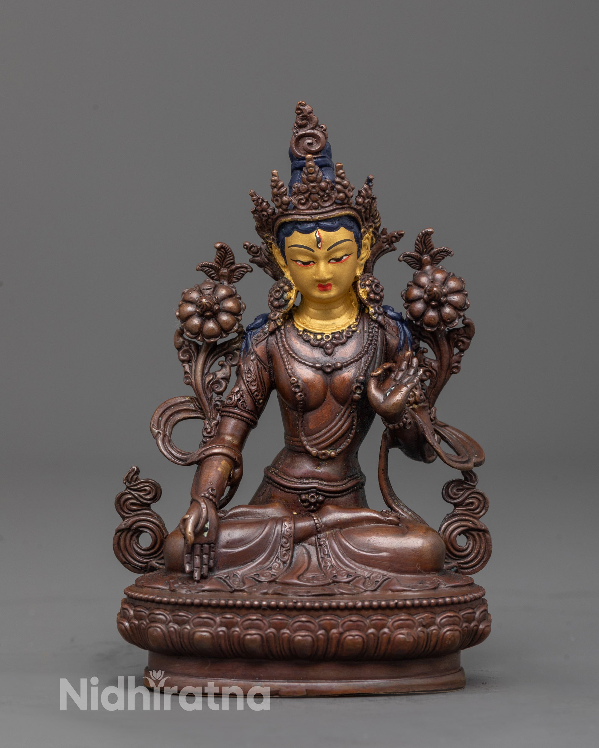front view White Tara Statue in oxidized copper with gold-plated face and floating robes