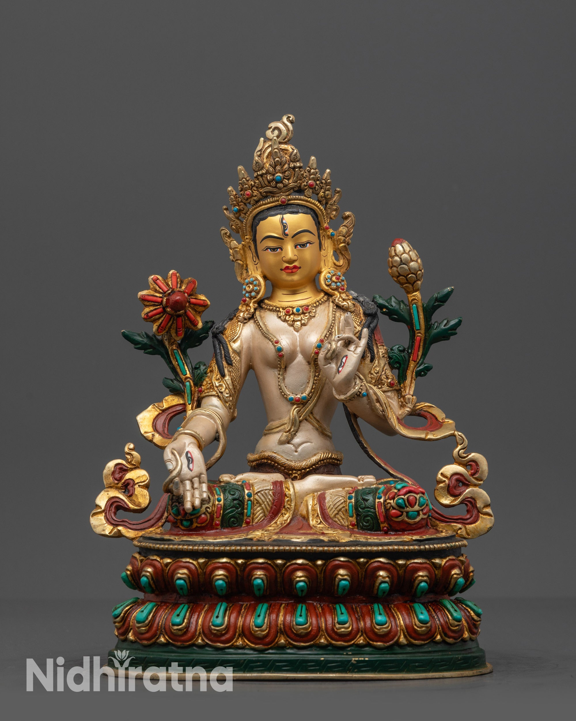 front view White Tara sculpture with gold-gilded face and lotus throne
