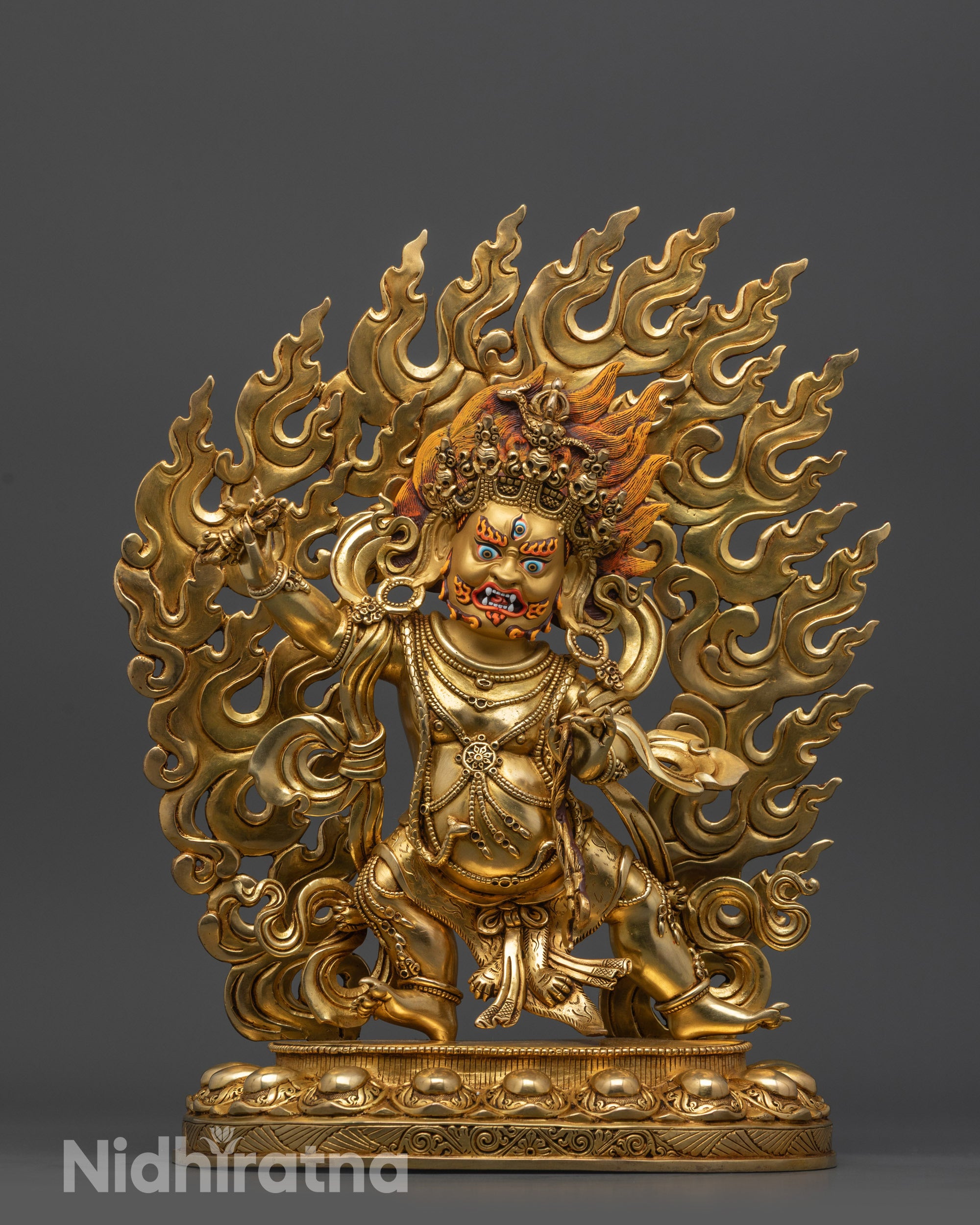 front view Wrathful Vajrapani statue with gold-gilded face and blazing halo
