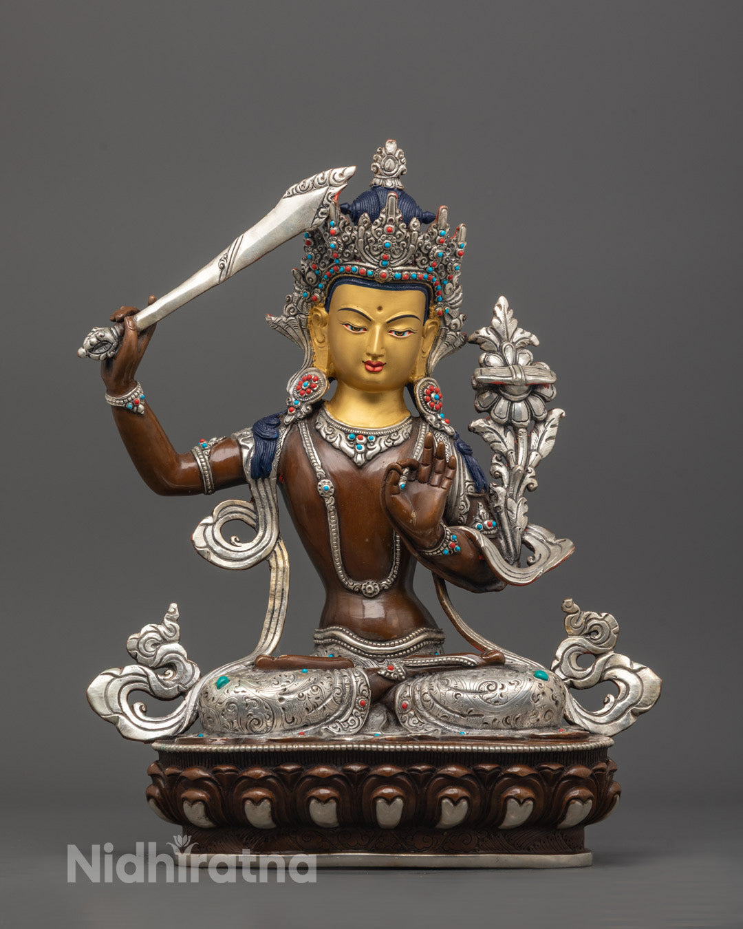 front view of Antique Manjushri Statue with 24K gold face, sword, and scripture on lotus throne