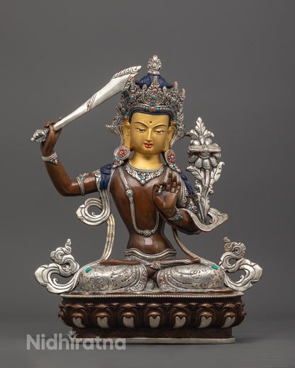 front view of Antique Manjushri Statue with 24K gold face, sword, and scripture on lotus throne