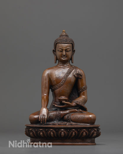 front view of Awakened Shakyamuni Buddha Statue with robe and patra in earth-touching mudra