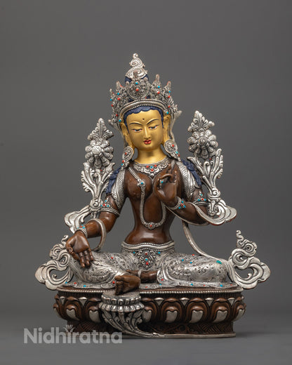 front view of Oxidized Green Tara Statue with 24K gold face and silver-plated lotus base