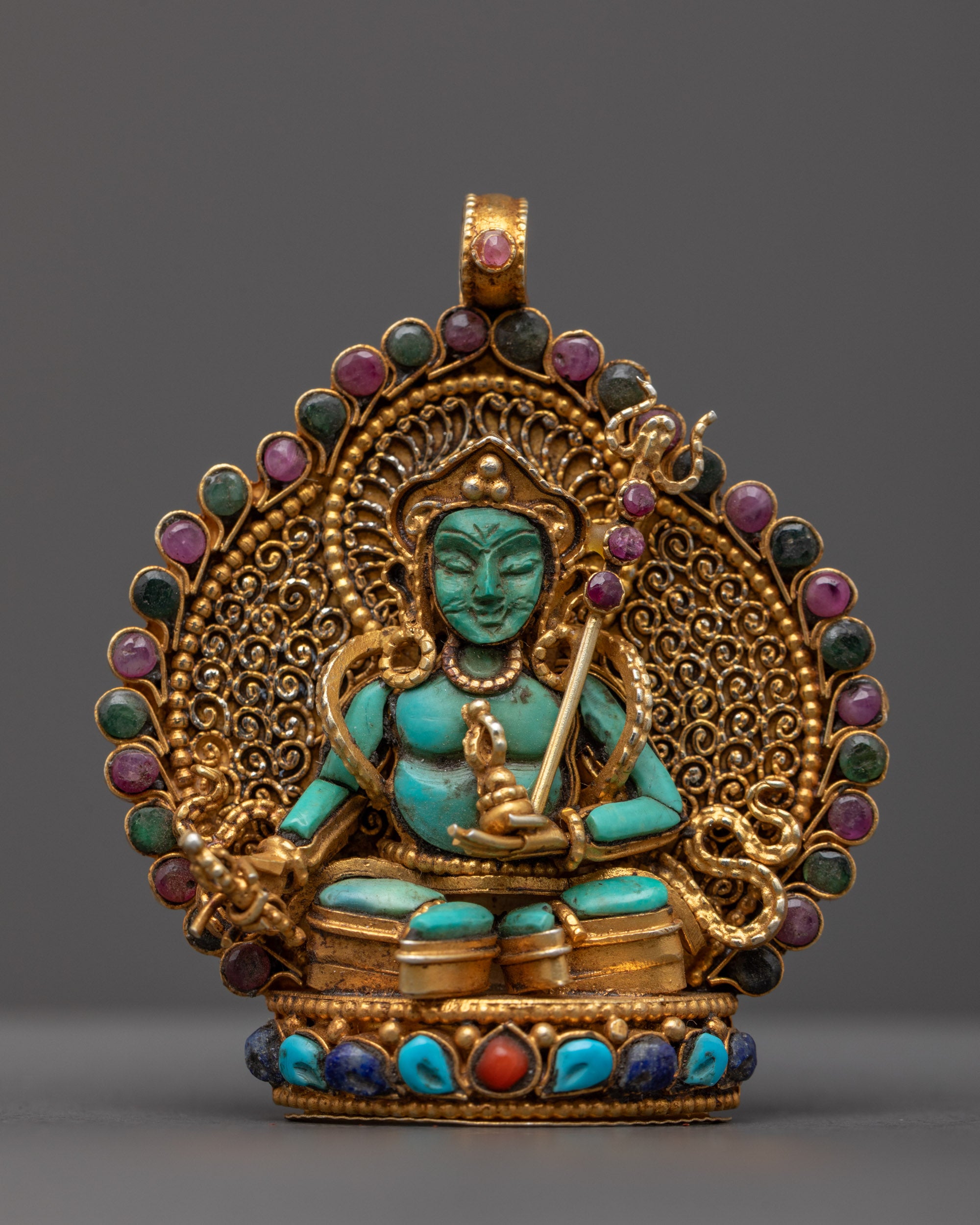 front view of Turquoise Guru Rinpoche locket with gold-gilded filigree and gemstones