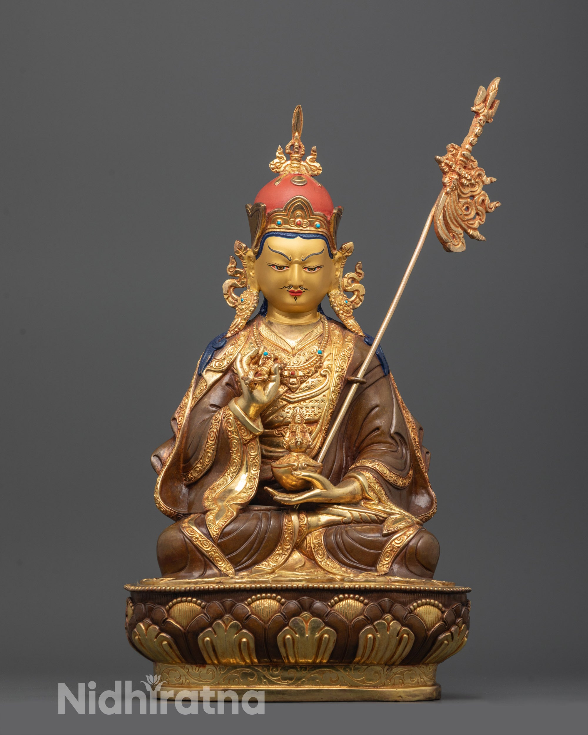 front view of detailed tsokye dorje statue with gold gilded face and lotus hat