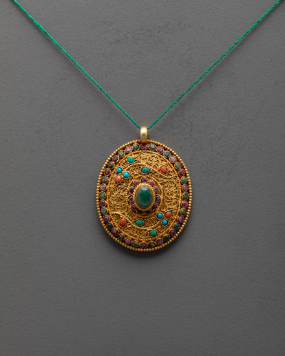 front view of gold-plated flower locket with emerald coral turquoise stones and filigree design