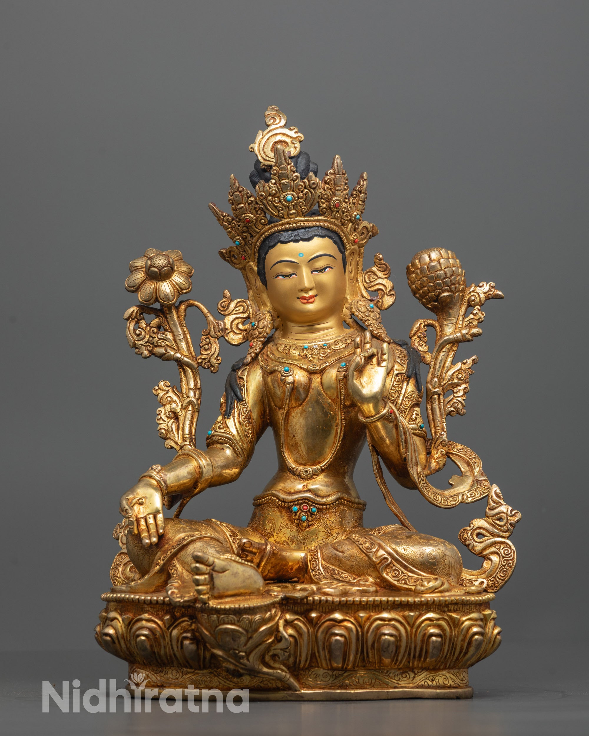 front view of gold gilded green tara statue with lotus seat and semi precious stones