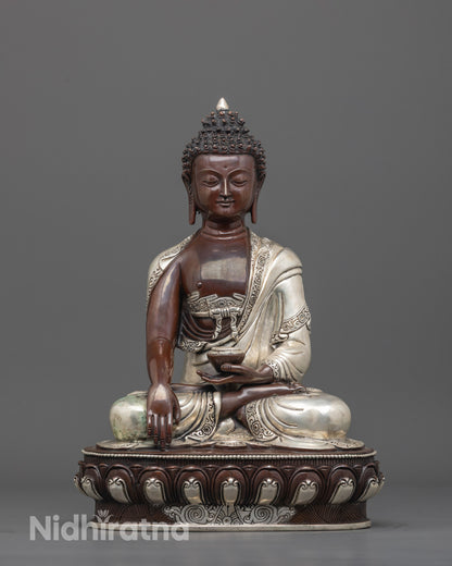 front view of handmade oxidized Buddha statue with silver-plated robe and patra bowl