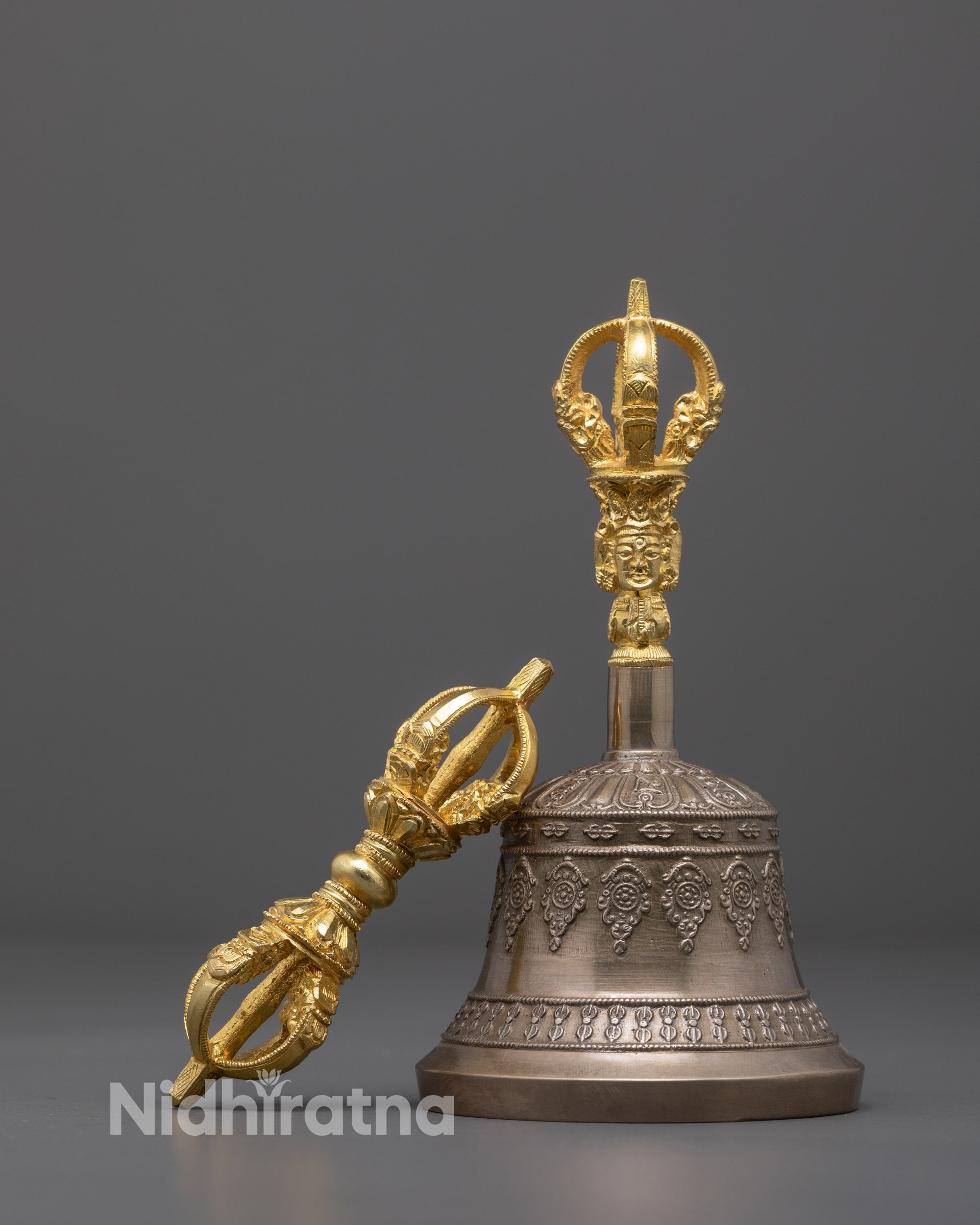 front view of handmade vajra and bell set with gold-plated copper and bronze design