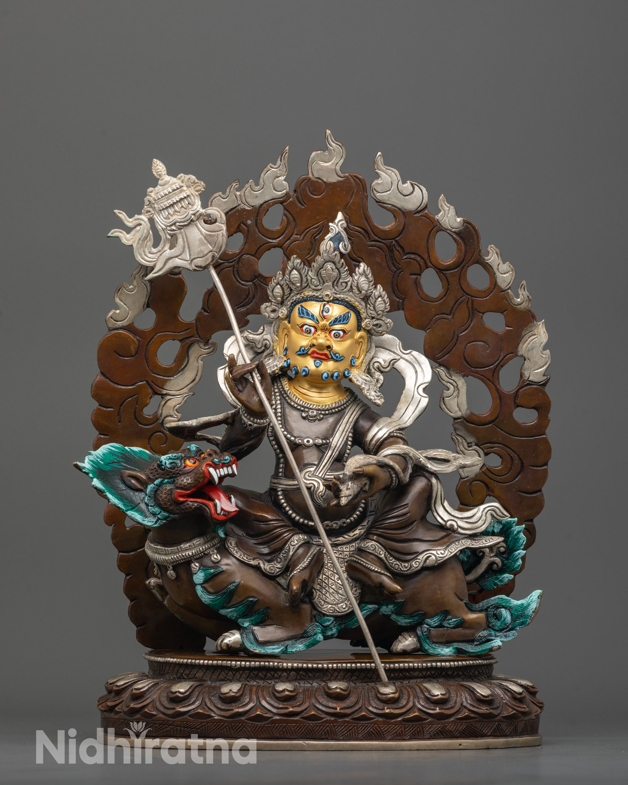 front view of namtoshe wealth deity statue with gold-gilded face and snow lion base