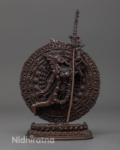 front view of oxidized Flying Vajrayogini statue with fire halo and skull crown detail