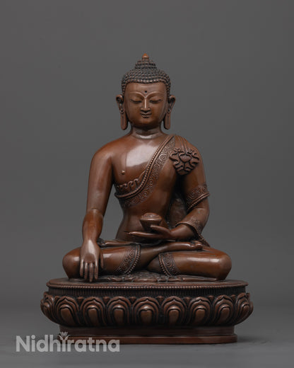 front view of oxidized Gautama Buddha statue with detailed robe and lotus seat