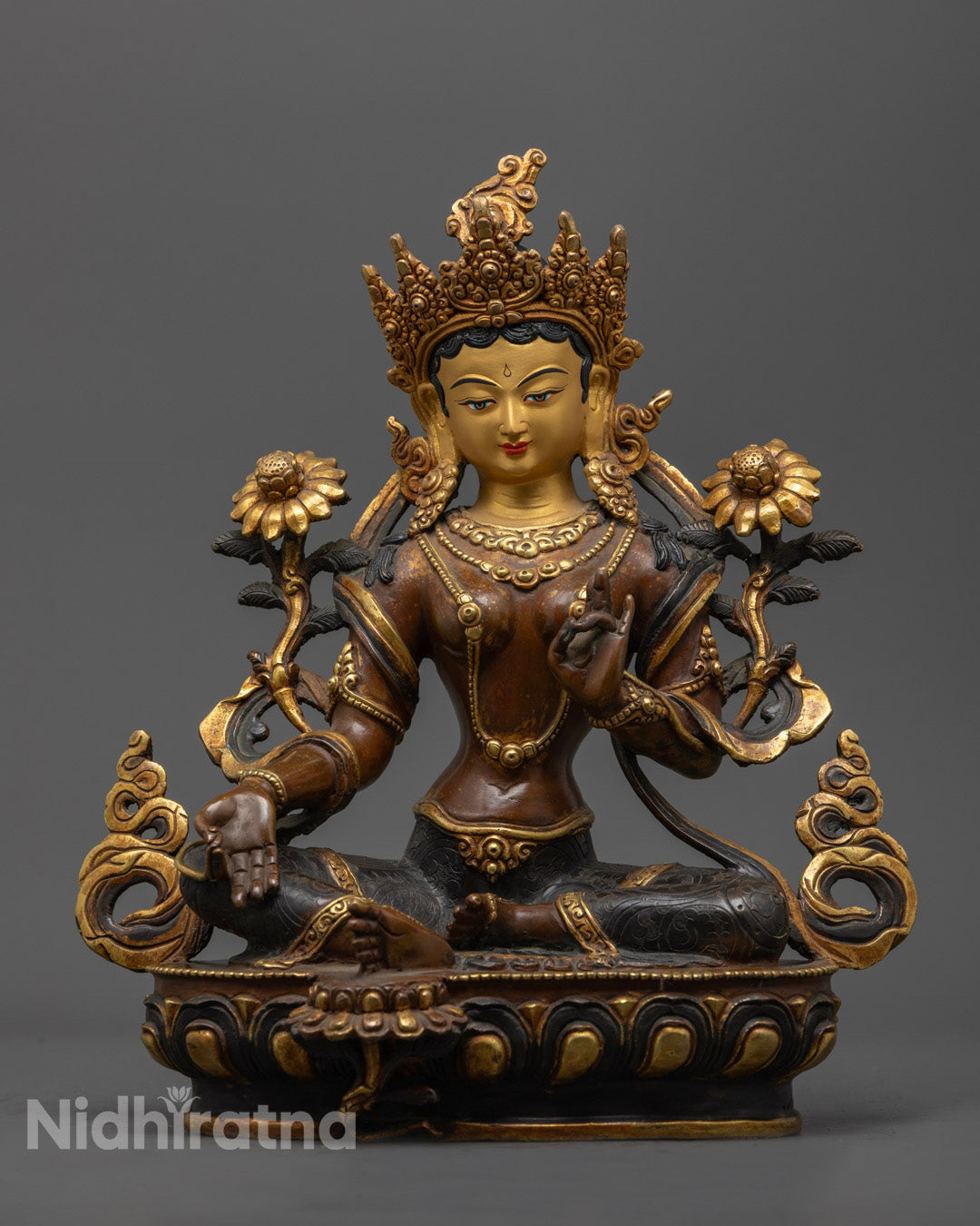 front view of oxidized copper green tara statue with gold-gilded face and lotus base