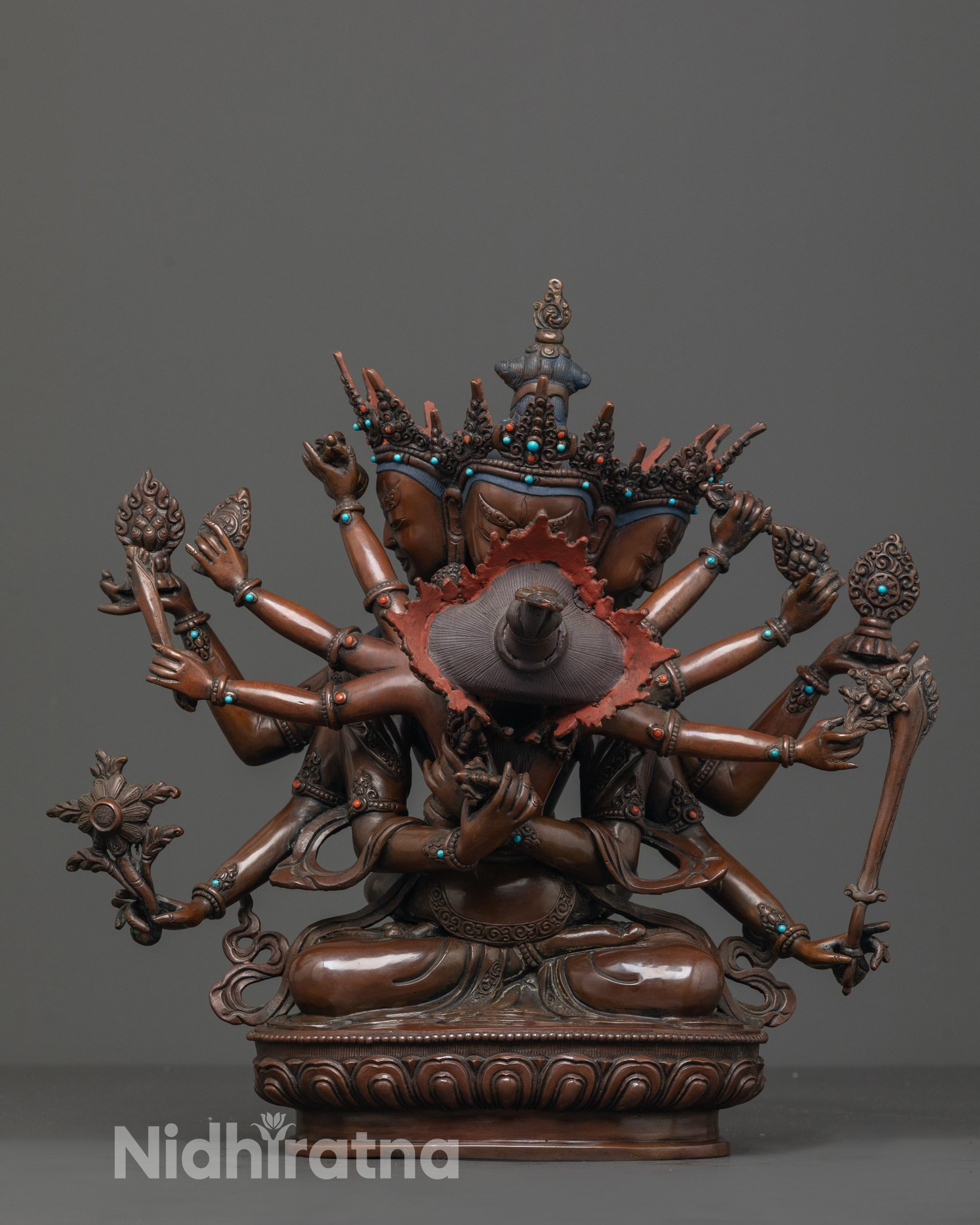 front view of oxidized copper guhysamaja union statue with three faces and six arms