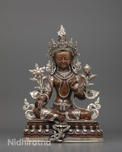 front view of oxidized green tara statue with silver-plated crown and lotus seat for meditation spaces