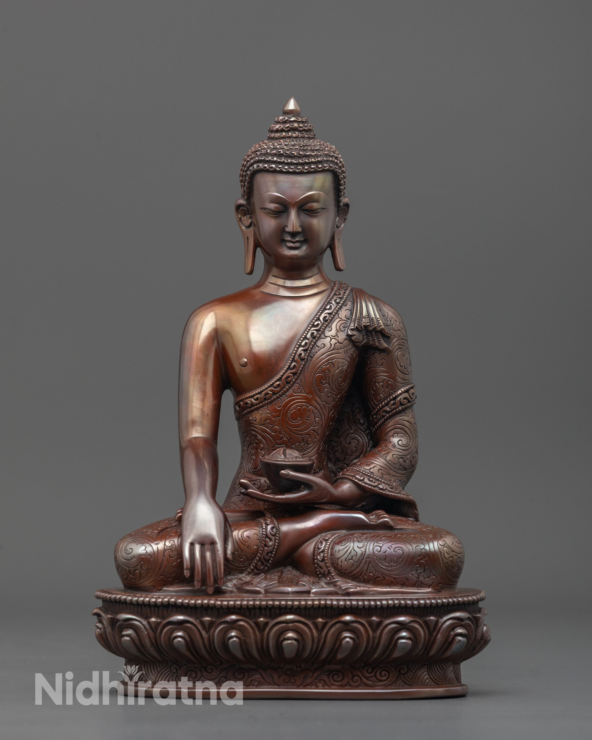 front view of oxidized shakyamuni buddha statue in earth touching mudra with lotus seat
