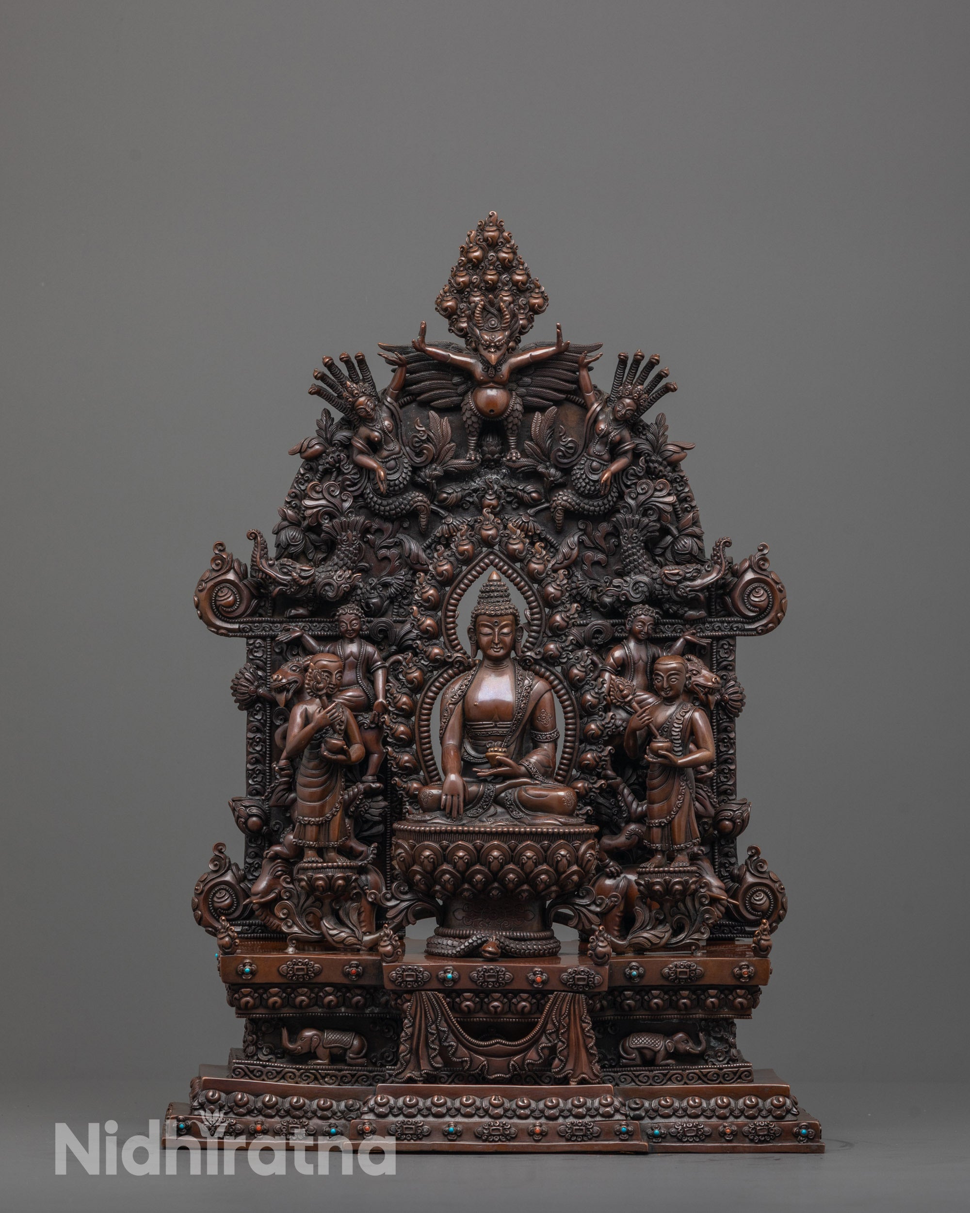 front view of oxidized shakyamuni buddha statue with disciples and lotus throne