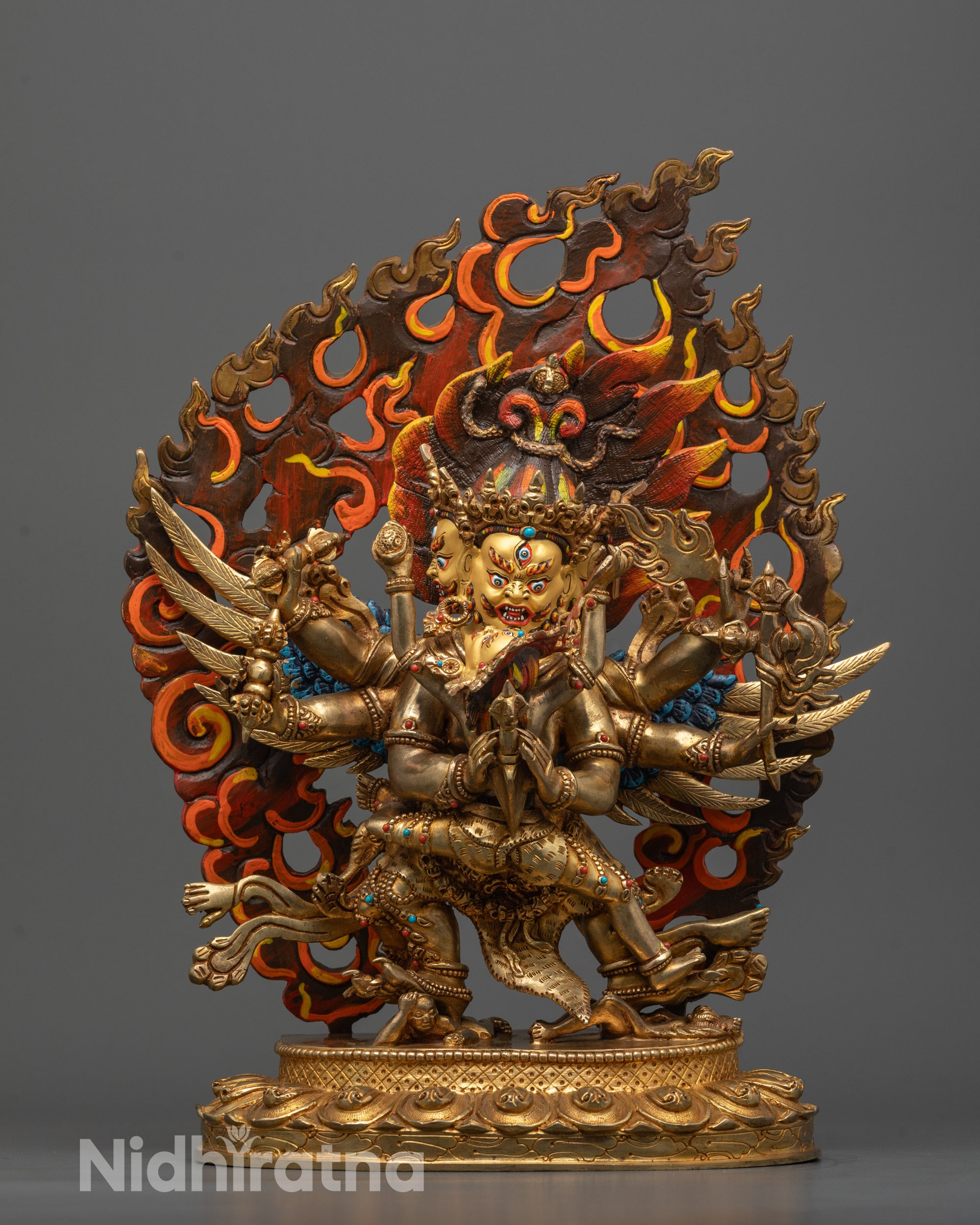 front view of vajrakilaya consort statue with gold-gilded face and wrathful expression