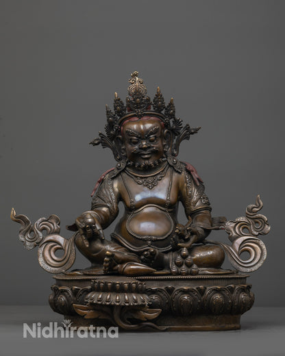 front view oxidized Dzambhala statue with jeweled crown and lotus seat
