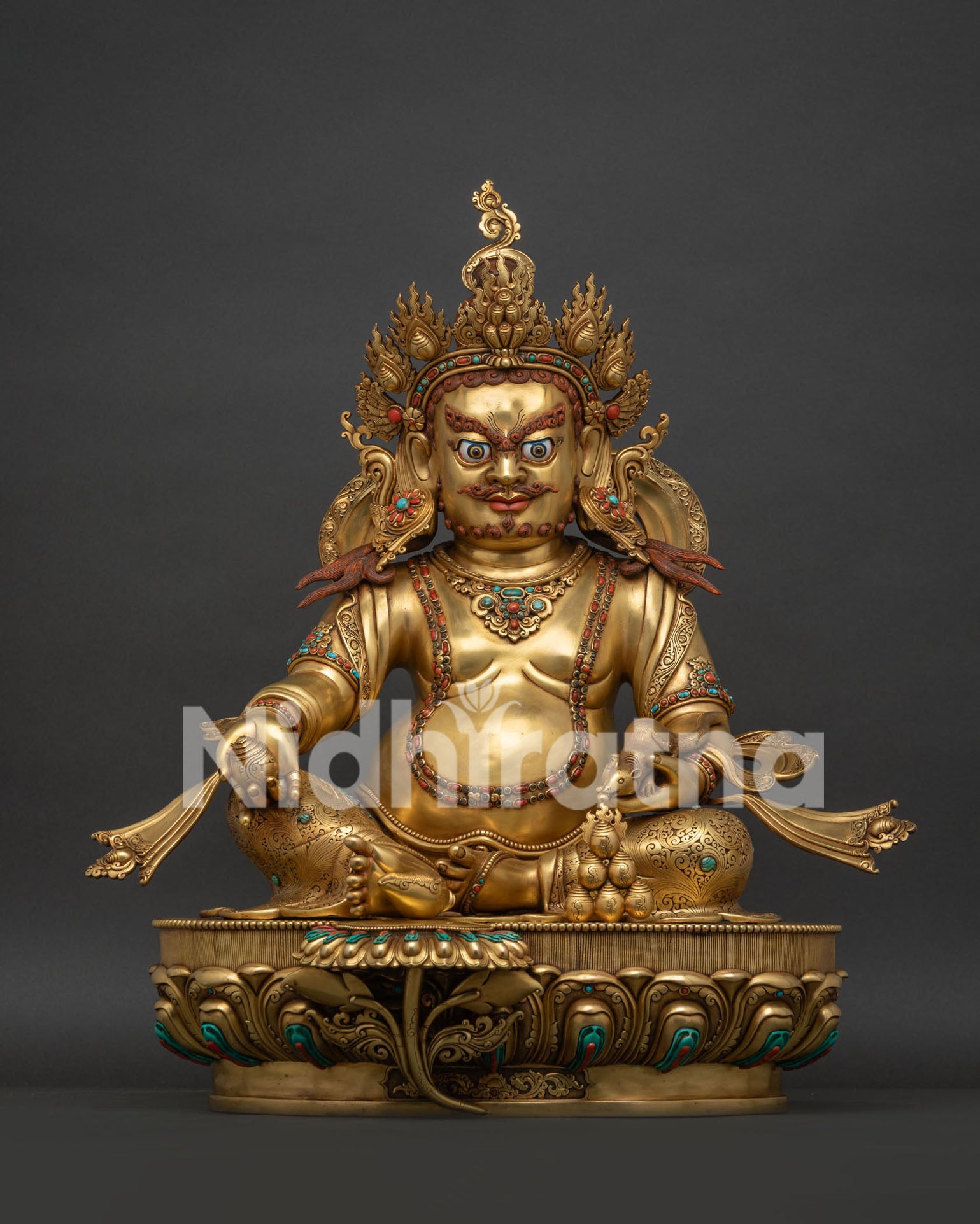 Full front view of gold fire-gilded Dzambhala statue with turquoise and coral inlays.