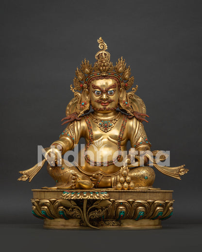 Full front view of gold fire-gilded Dzambhala statue with turquoise and coral inlays.