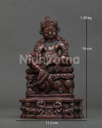 Full front view of seated Dzambhala statue on carved base in oxidized copper with turquoise stones