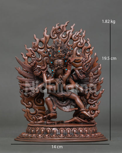 Full front view of Vajrakilaya statue in oxidized copper with turquoise accents and flame halo