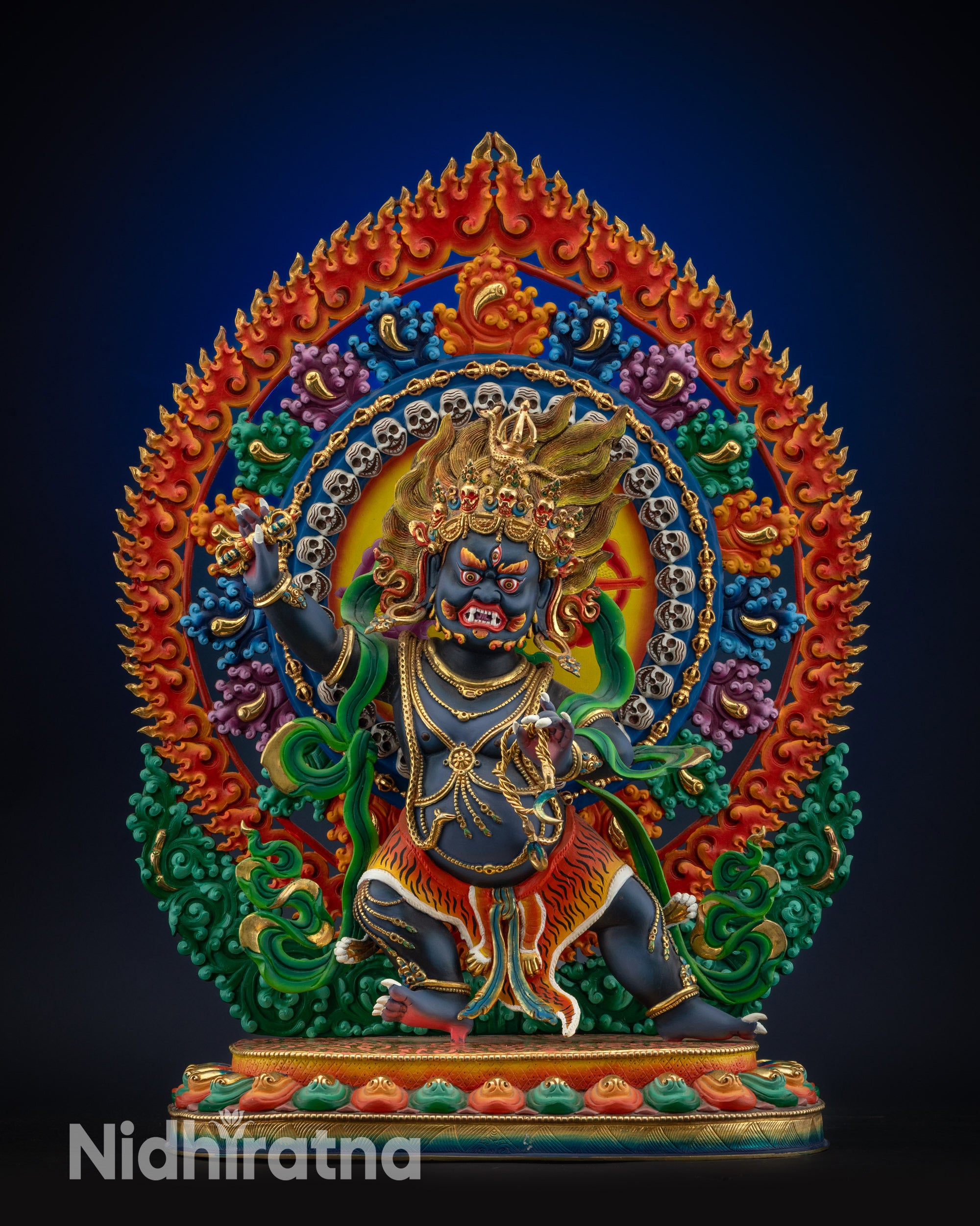 full view Vajrapani statue on lotus pedestal with vibrant colors and gold accents
